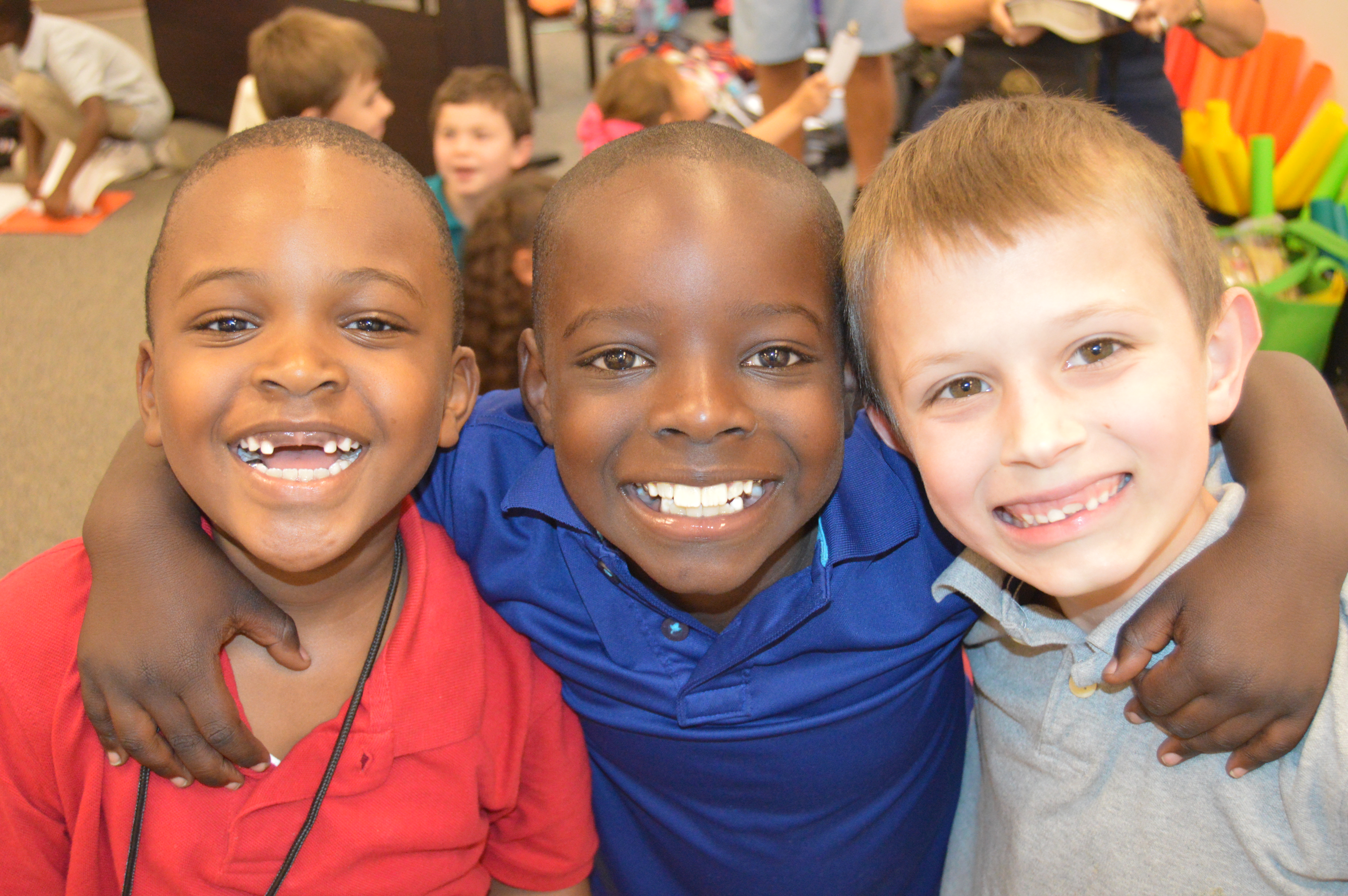 Children gathered together during a ministry program, smiling and engaged in activities